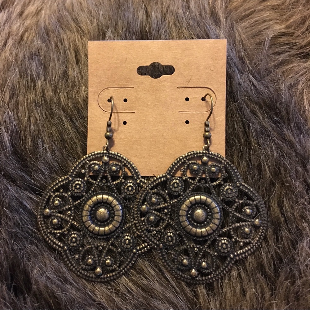 Large brass tone filigree disc pierced earrings